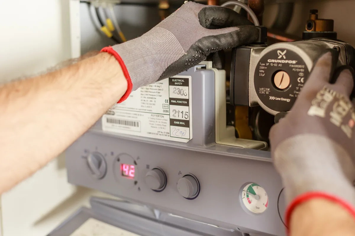 Technician working on a water system connection